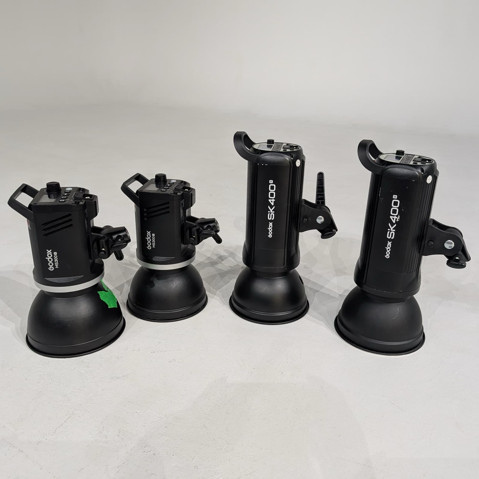Four Godox strobes set out on the cyc: two MS300-Vs and two SK400 IIs